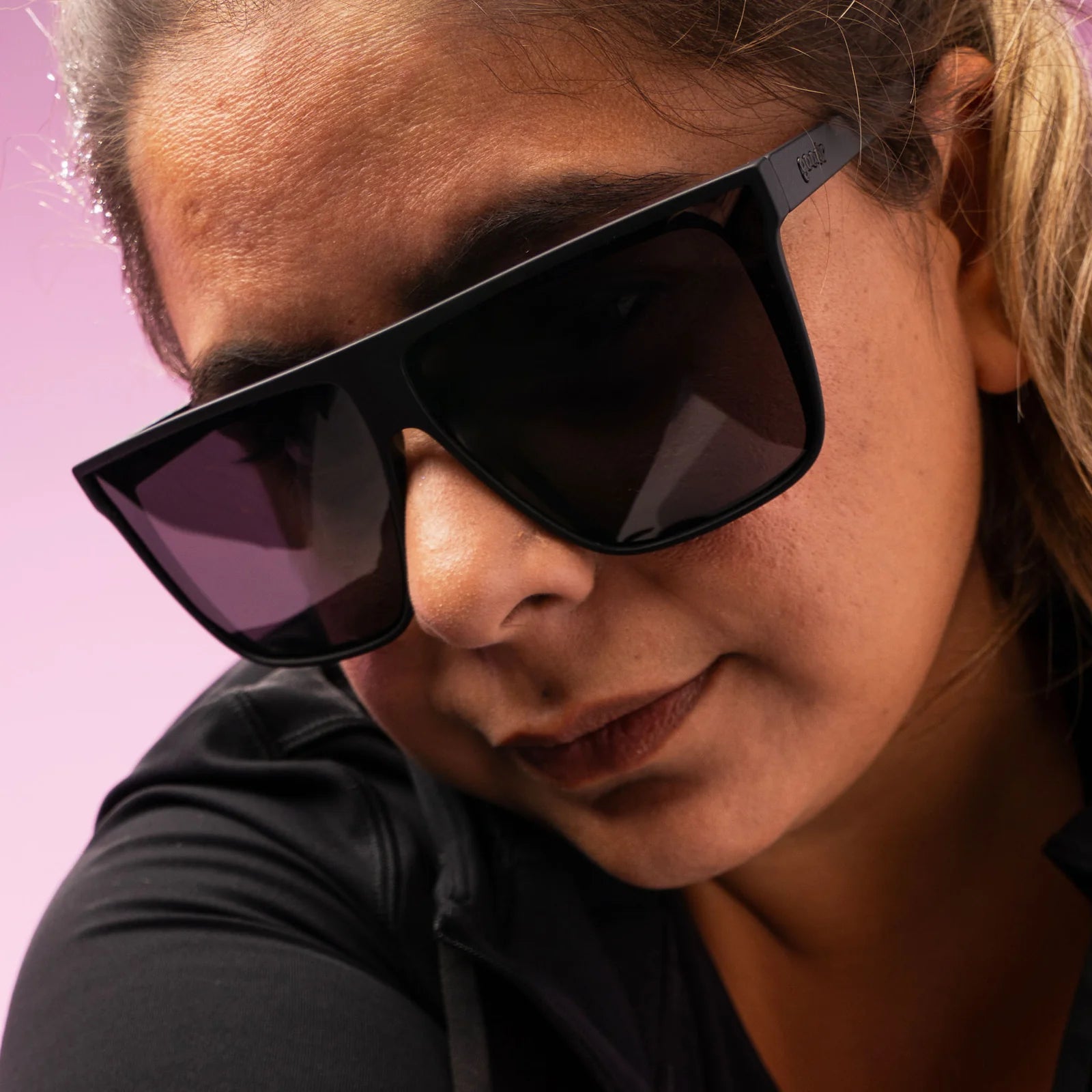 Black wide-fit, oversized sunglasses with non-reflective lenses. No slip, no bounce, all polarised.