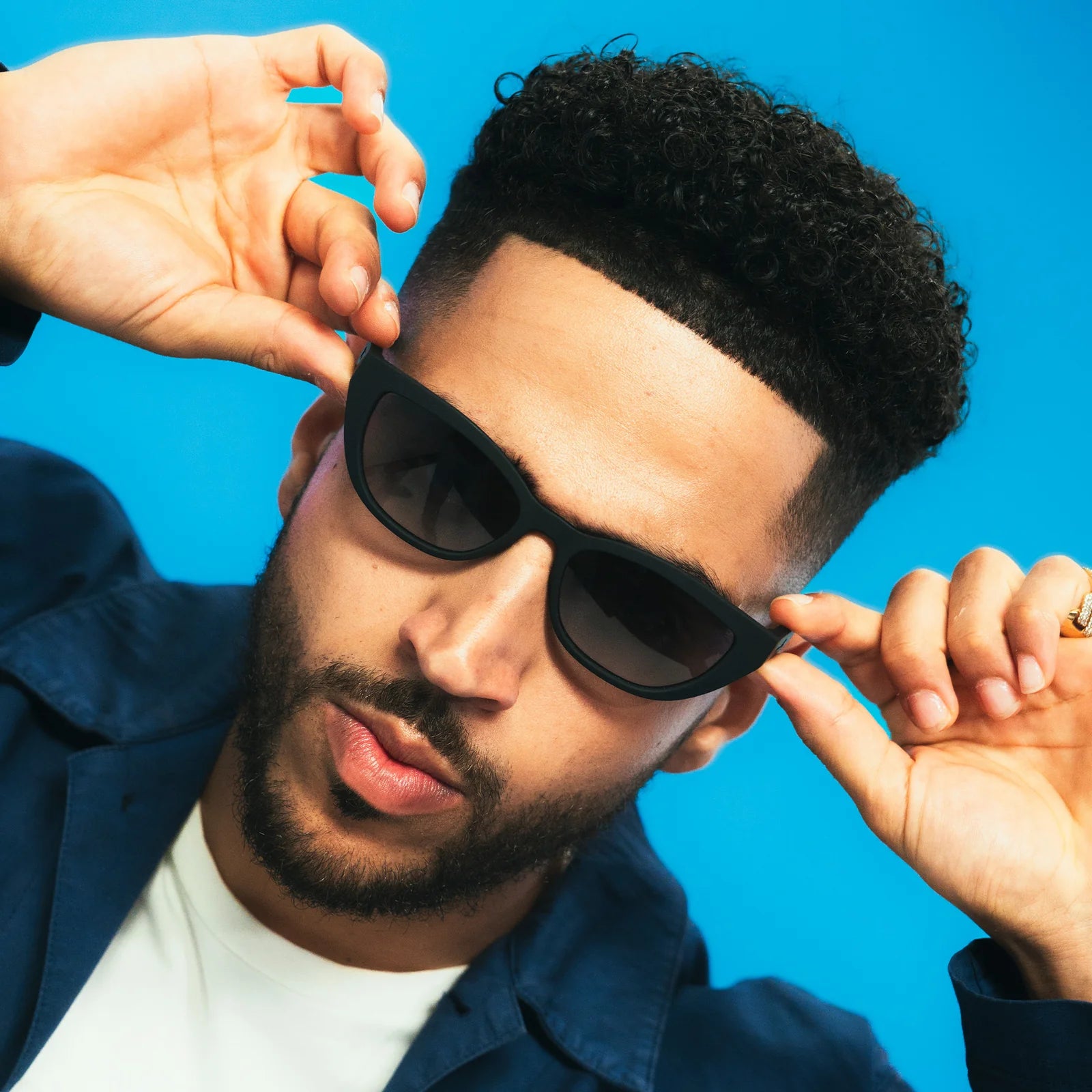 Black sunglasses with dark, gradient lenses. Simple and stylish cat-eye frames.