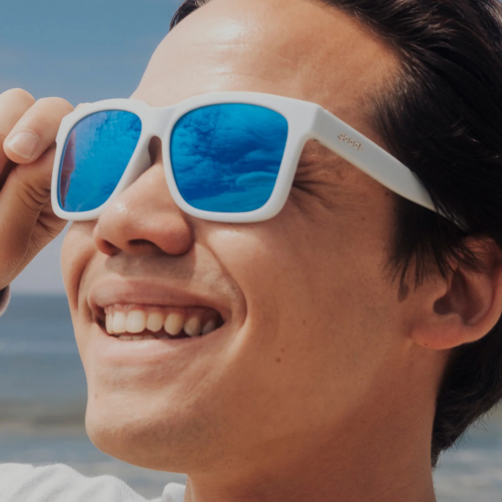 Light blue sunglasses with mirrored reflective lenses. Water repellent and capable of floating.